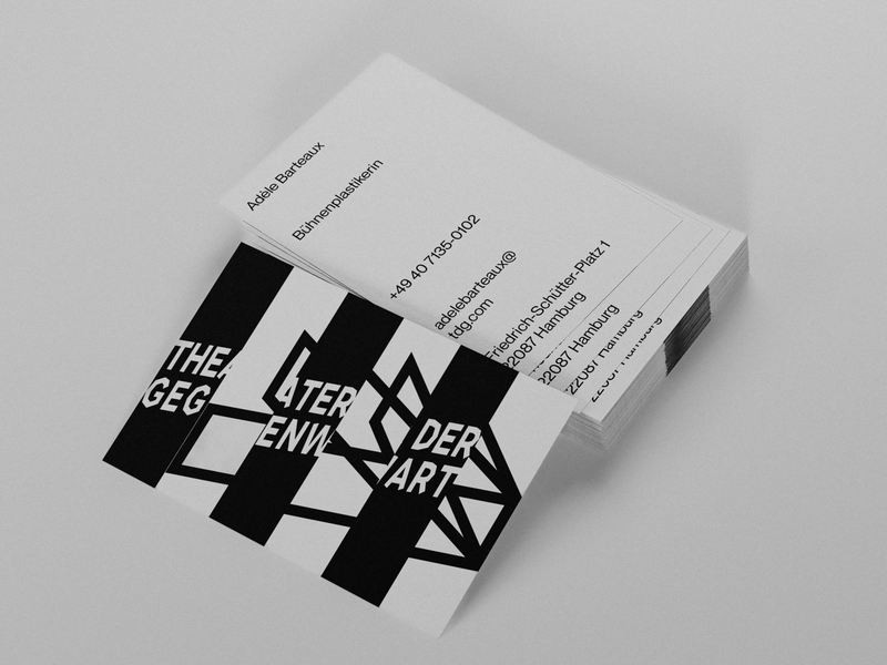 Stack of Theater der Gegenwart business cards showing the geometric multi-perspective stage logo in black and white